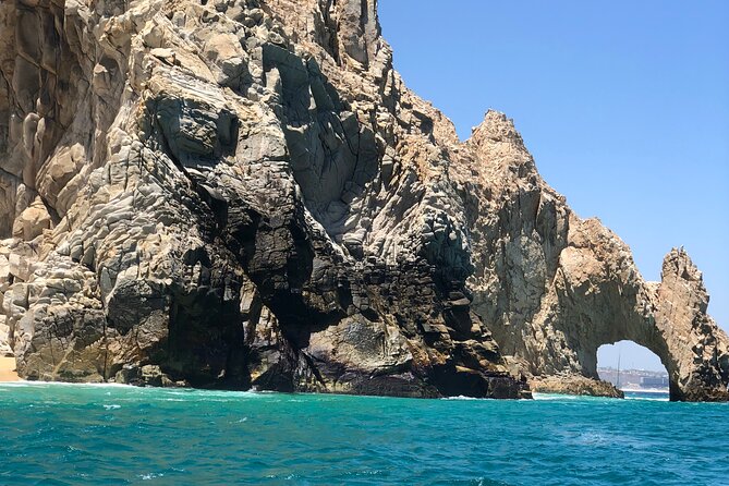 Boat Tour to Cabo San Lucas Arch and Rock Formations - Stop 3: Neptune’s Finger for Shape, Story, and Quick Photos