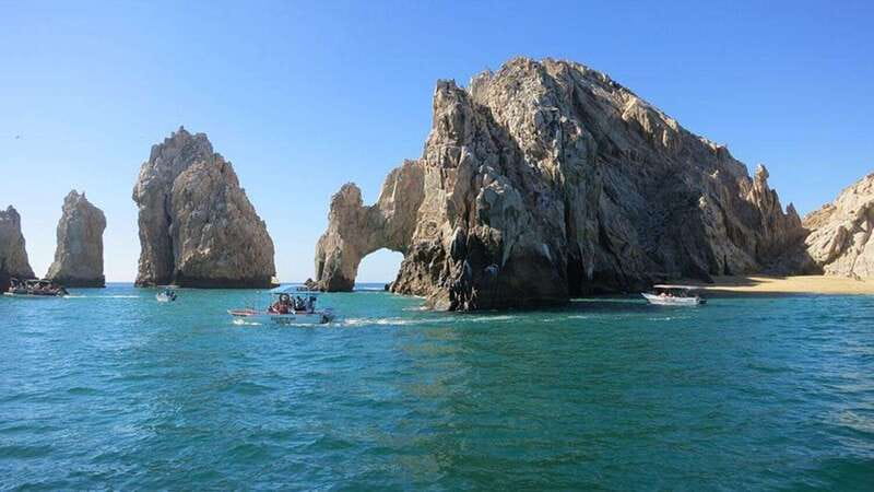 Cabo San Lucas: glass-bottom boat ride to "End of the Earth" - Arch of Cabo San Lucas and the two beaches with a story