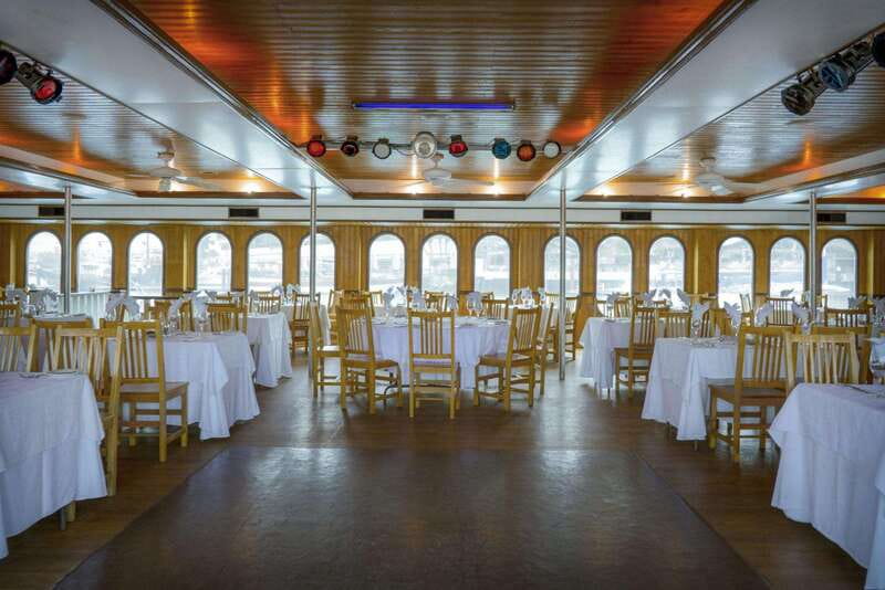 Cabo San Lucas: Sunset Premier Dinner & Show Cruise - The air-conditioned dinner room: plated meal, real choices, seasonal add-ons