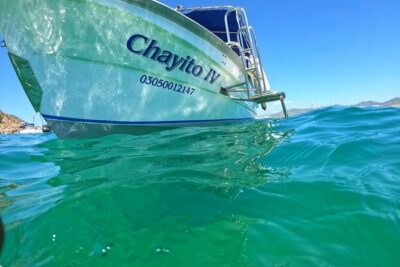 Glass Bottom Boat to the Arch and Lovers Beach: Optional Pickup - The route: Pelican Rock, Neptune’s Finger, and the story from the water