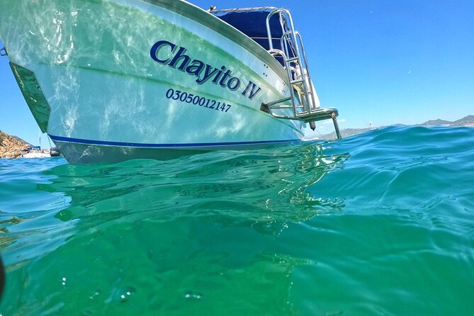 Glass Bottom Boat to the Arch and Lovers Beach: Optional Pickup - The route: Pelican Rock, Neptune’s Finger, and the story from the water