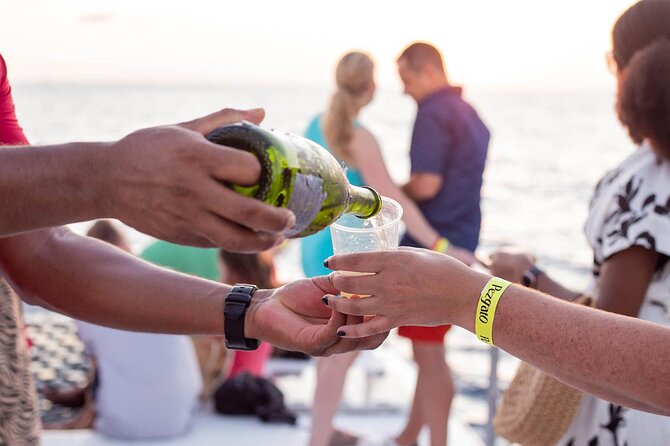 Sunset Cruise in Los Cabos with Jazz and Wine - The vibe on board: jazz music, crew energy, and photo help